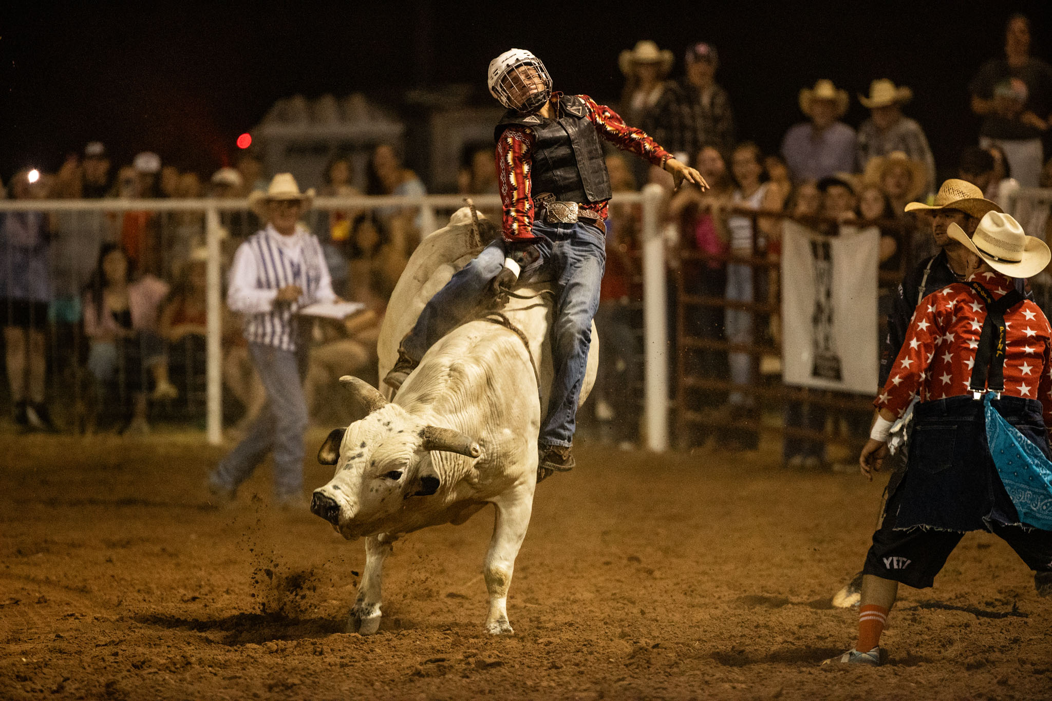 Bullfighters working around a bull in the arena