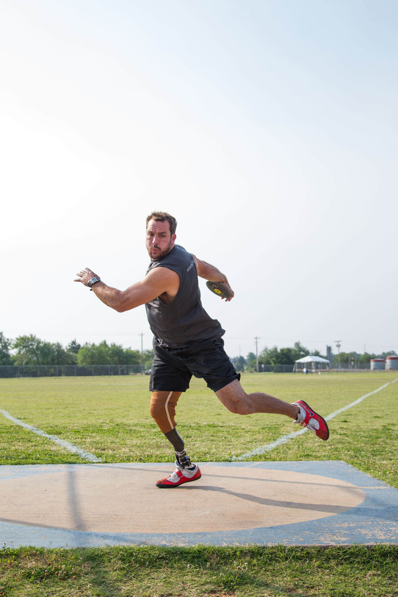 Discus thrower spinning in the throwing ring