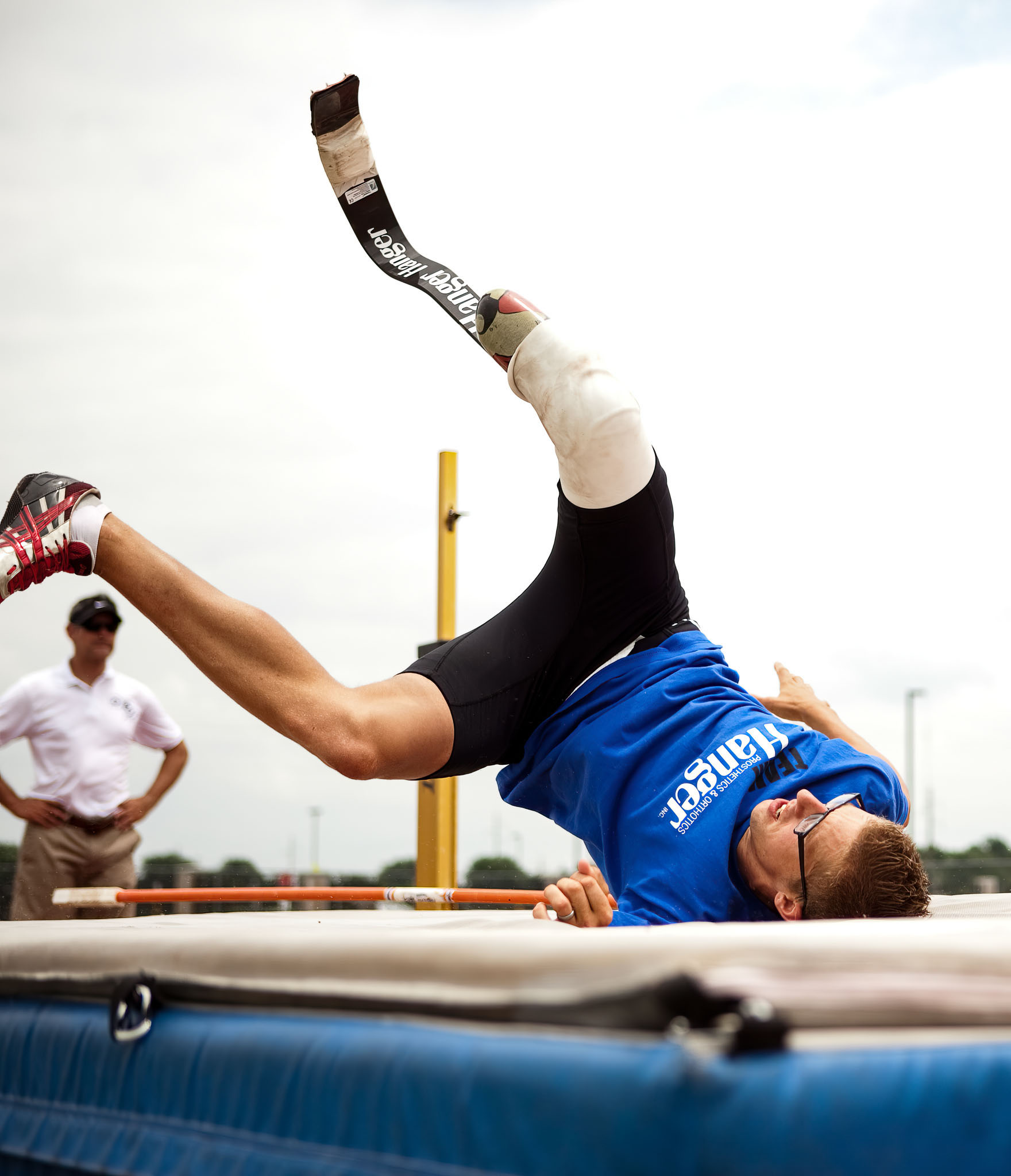 High jumper on a prosthetic leg clearing the bar