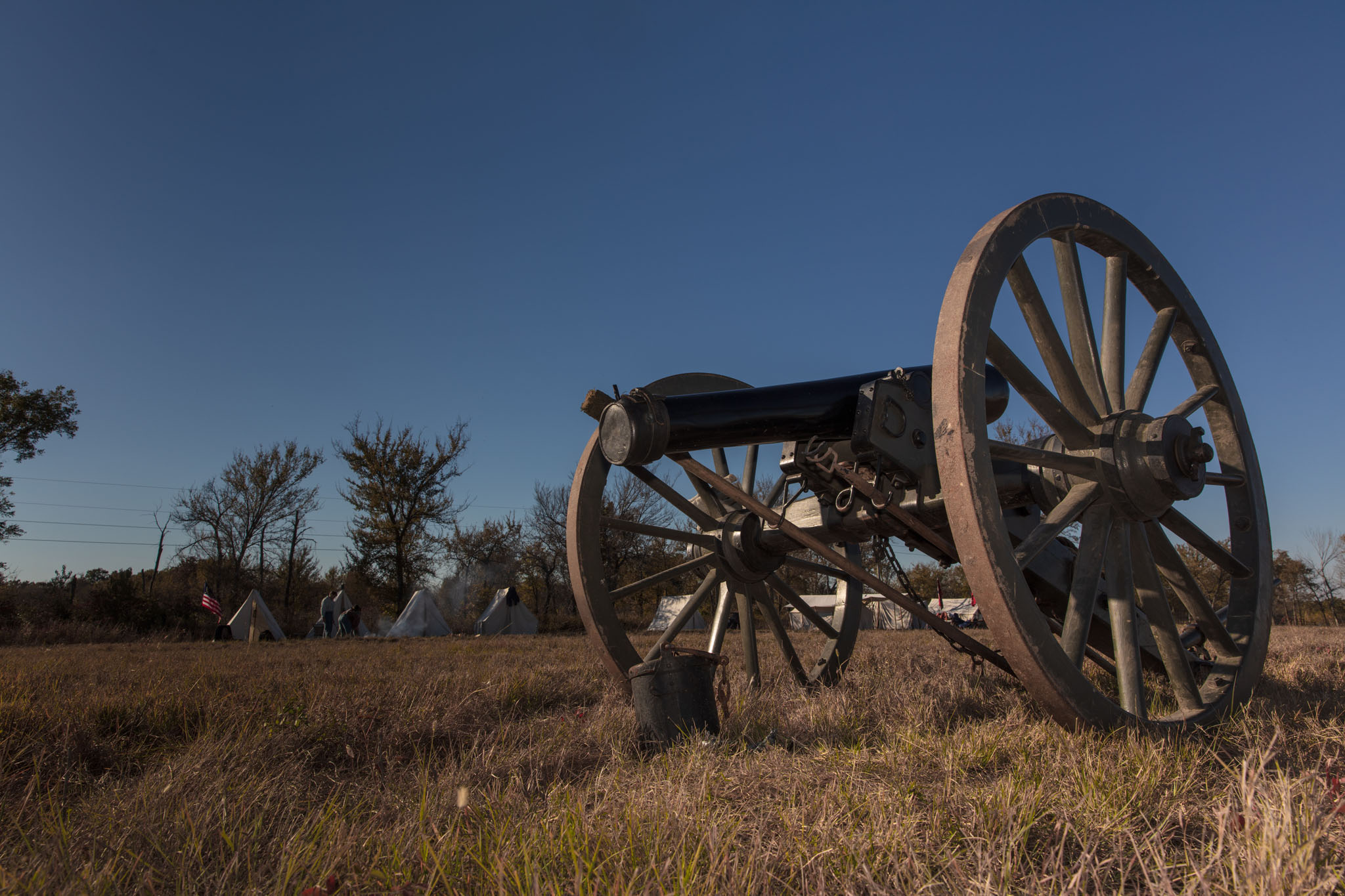 Cannon standing on the prairie under a blue sky
