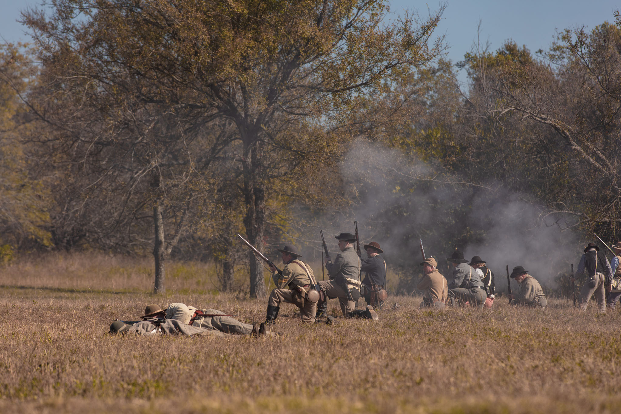 Fallen soldiers lying on the field as the battle continues