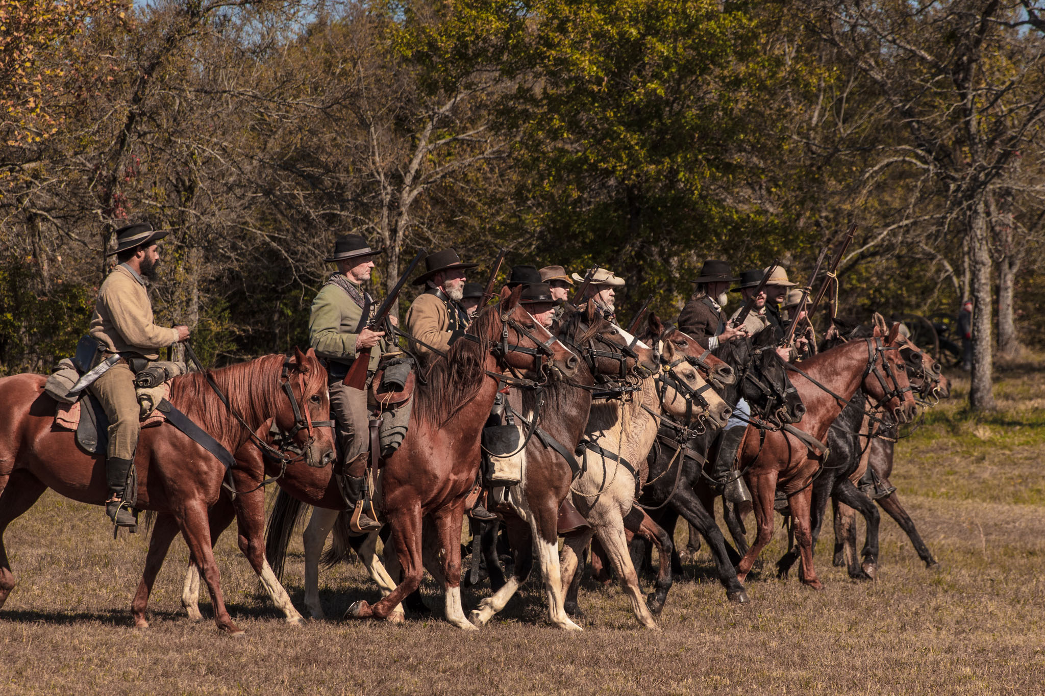 Confederate cavalry riding out of the trees