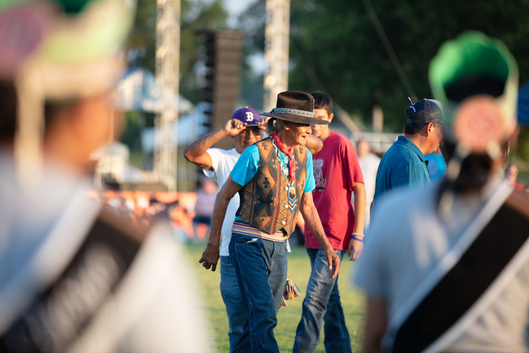 Men in traditional dress gathering on the festival grounds