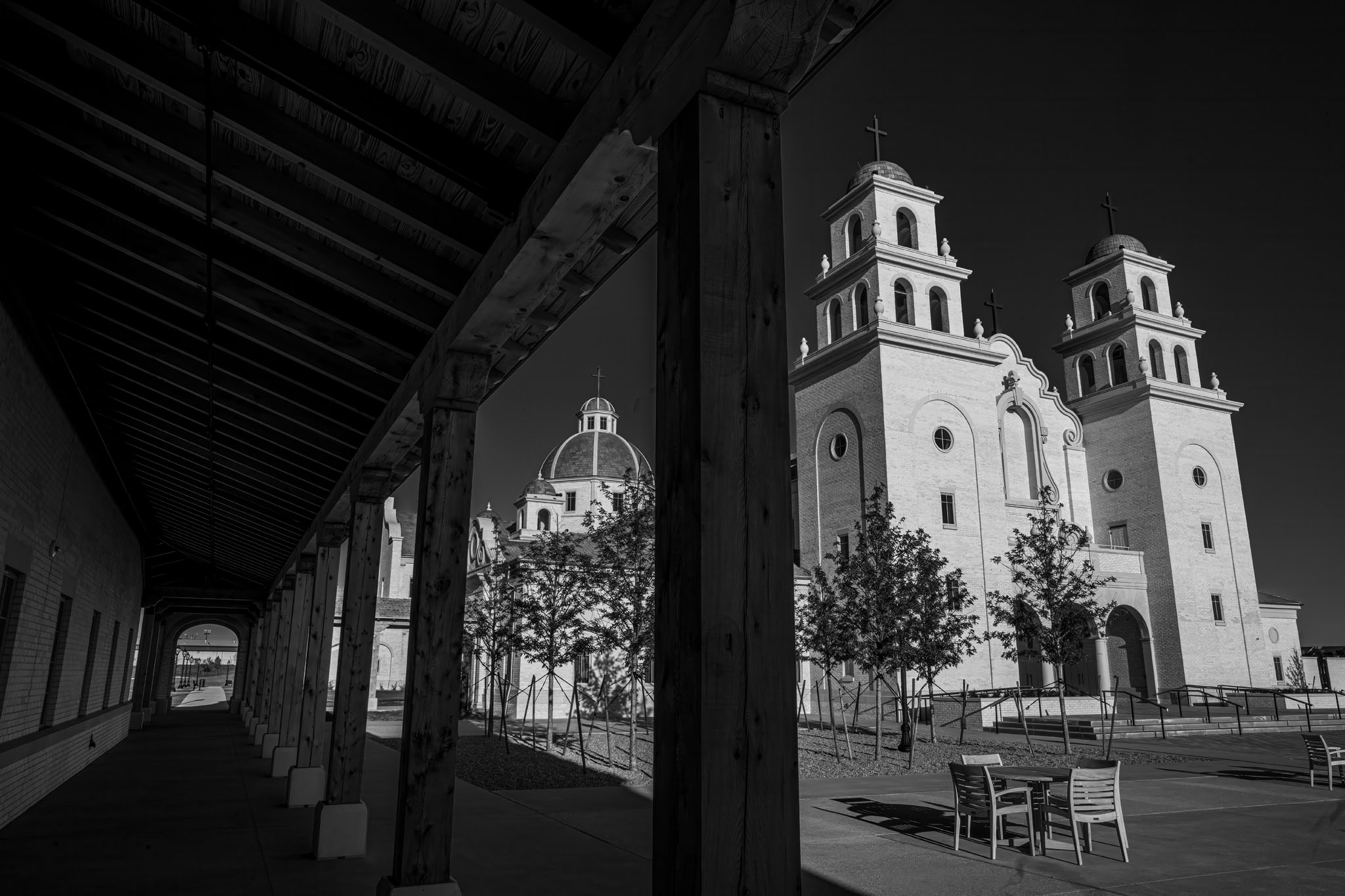 The shrine’s bell towers seen through the arcade of a covered walkway