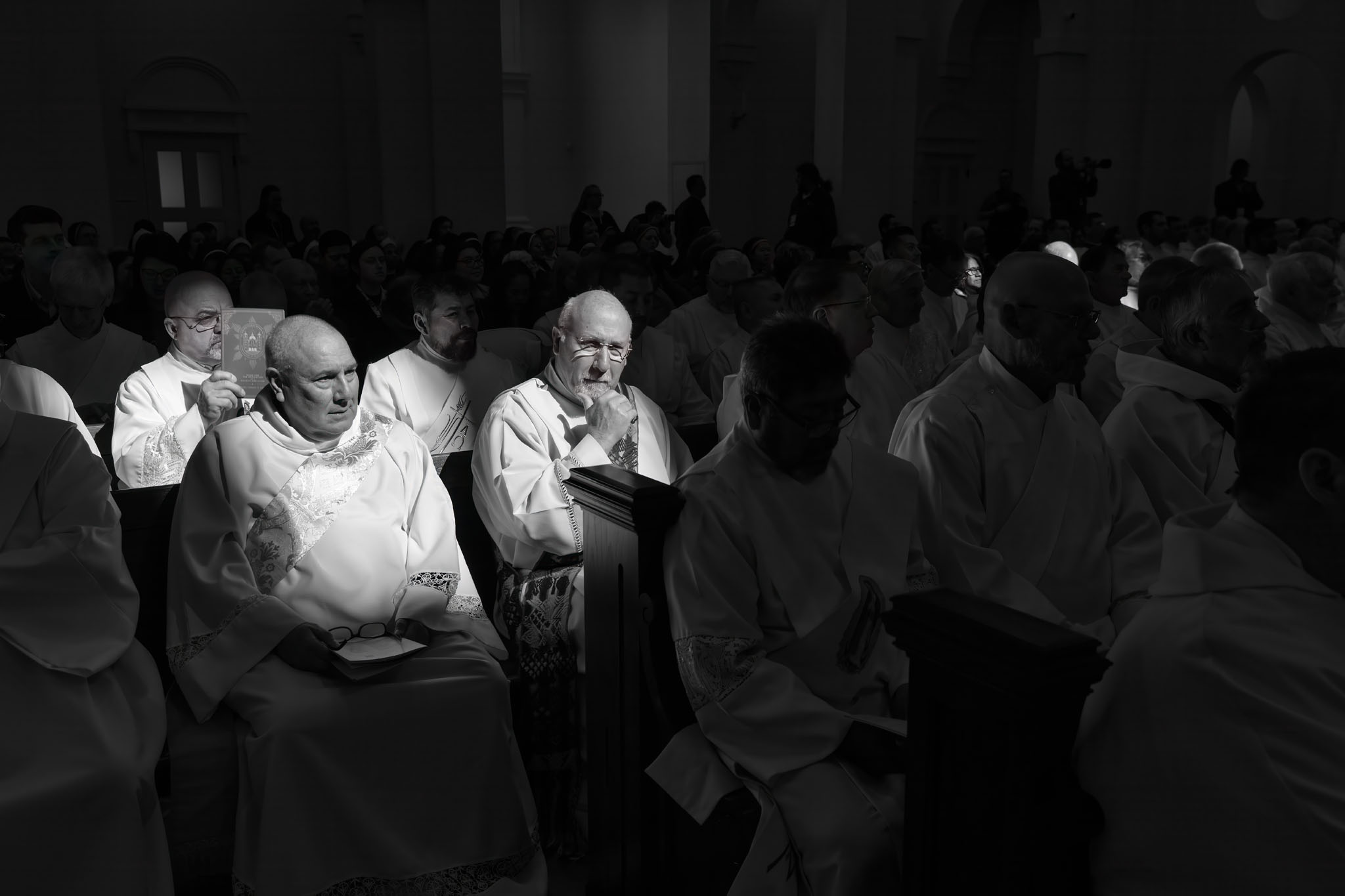 Clergy seated in the pews during the service