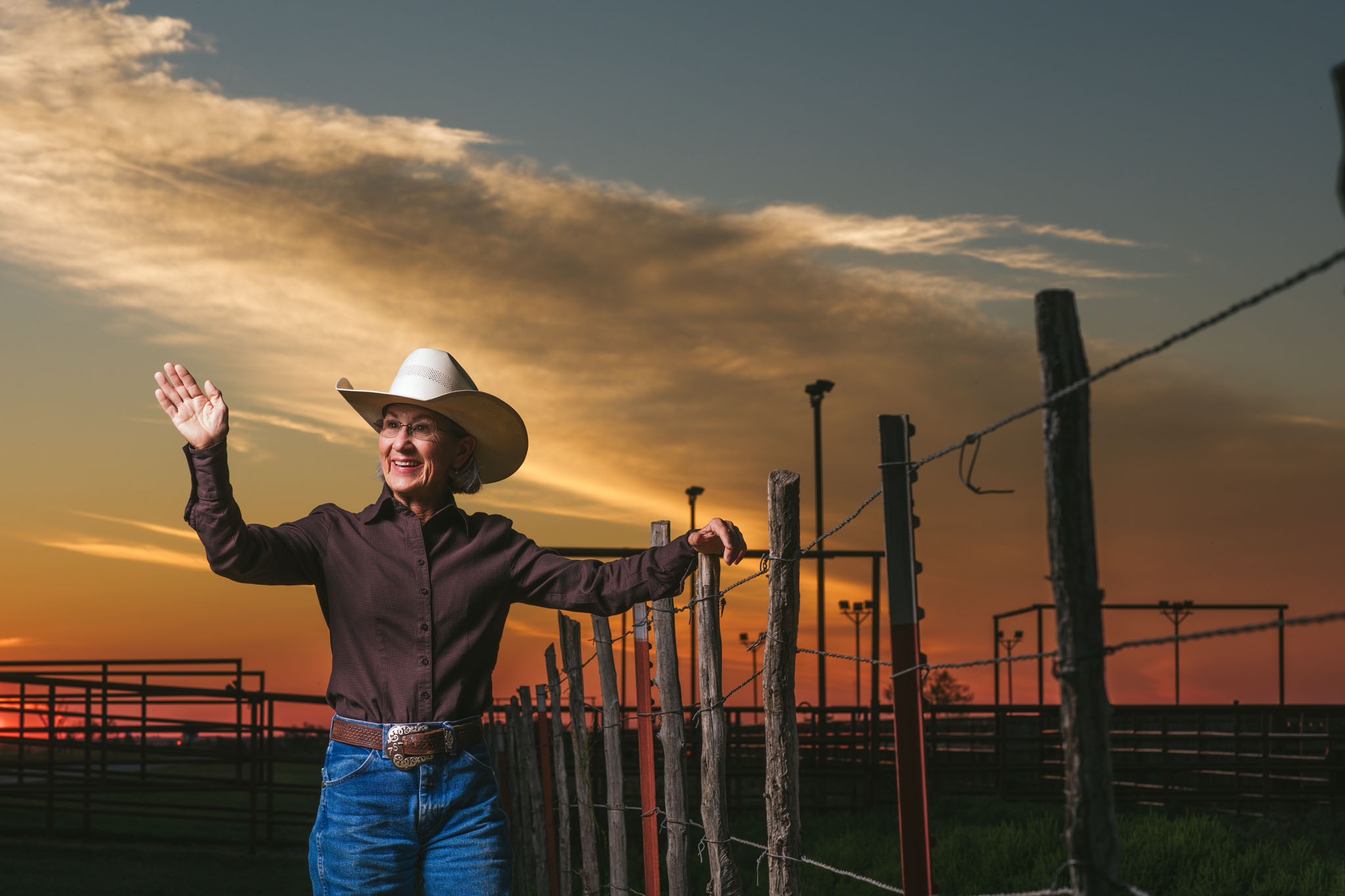 Terry Stuart Forst waving from the pens under a sunset sky