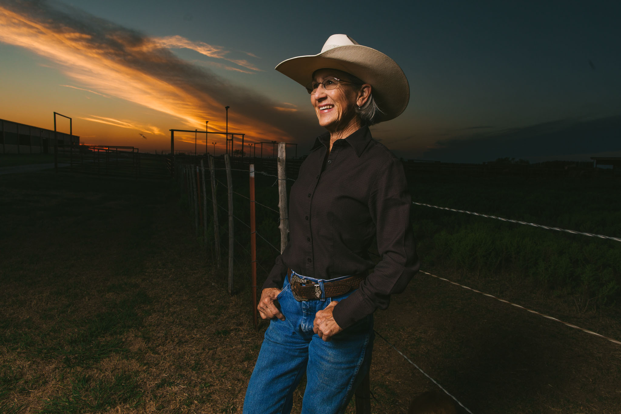 Portrait of Terry Stuart Forst at sunset beside the pens