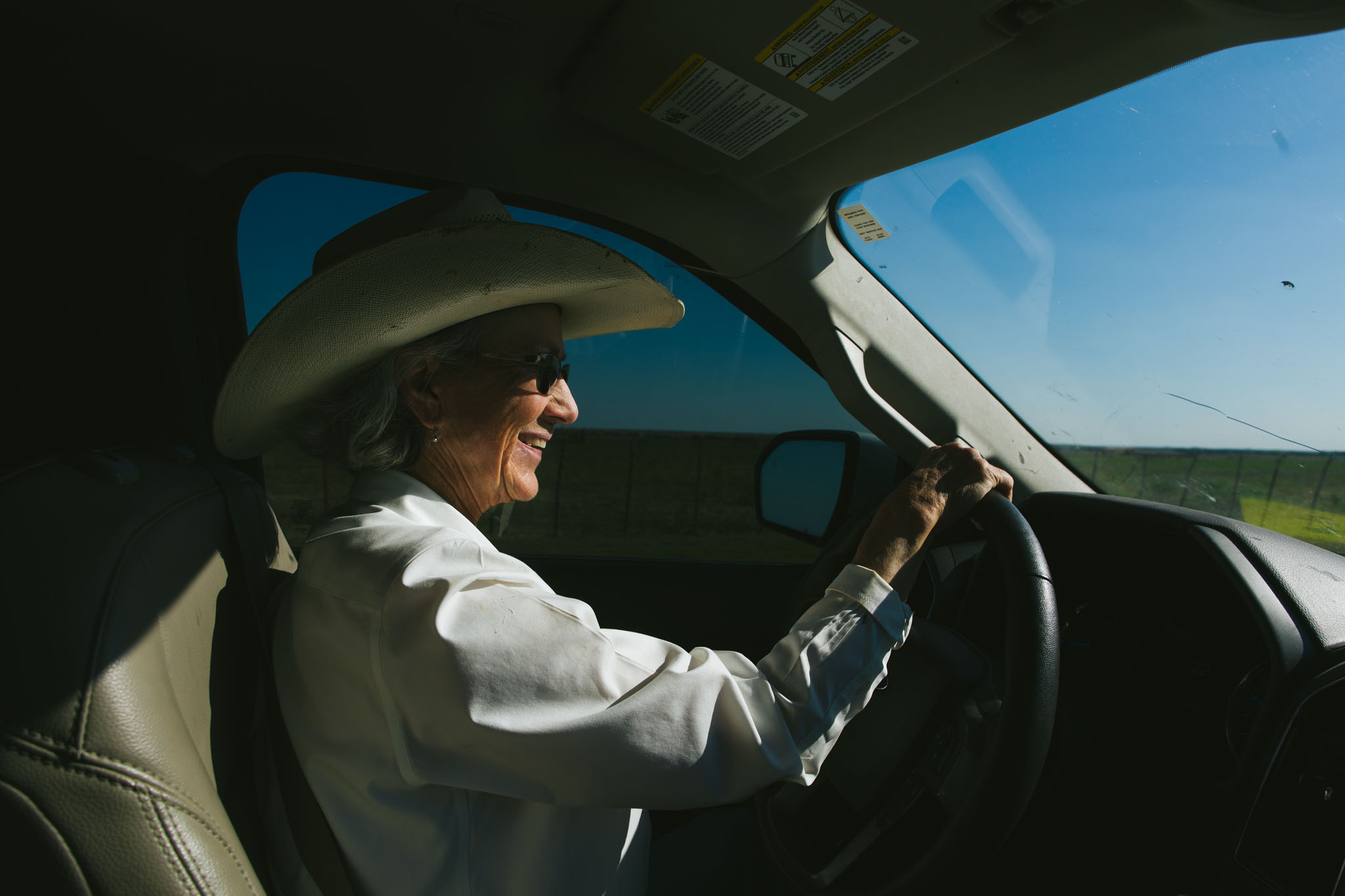 Terry Stuart Forst smiling behind the wheel of her ranch truck